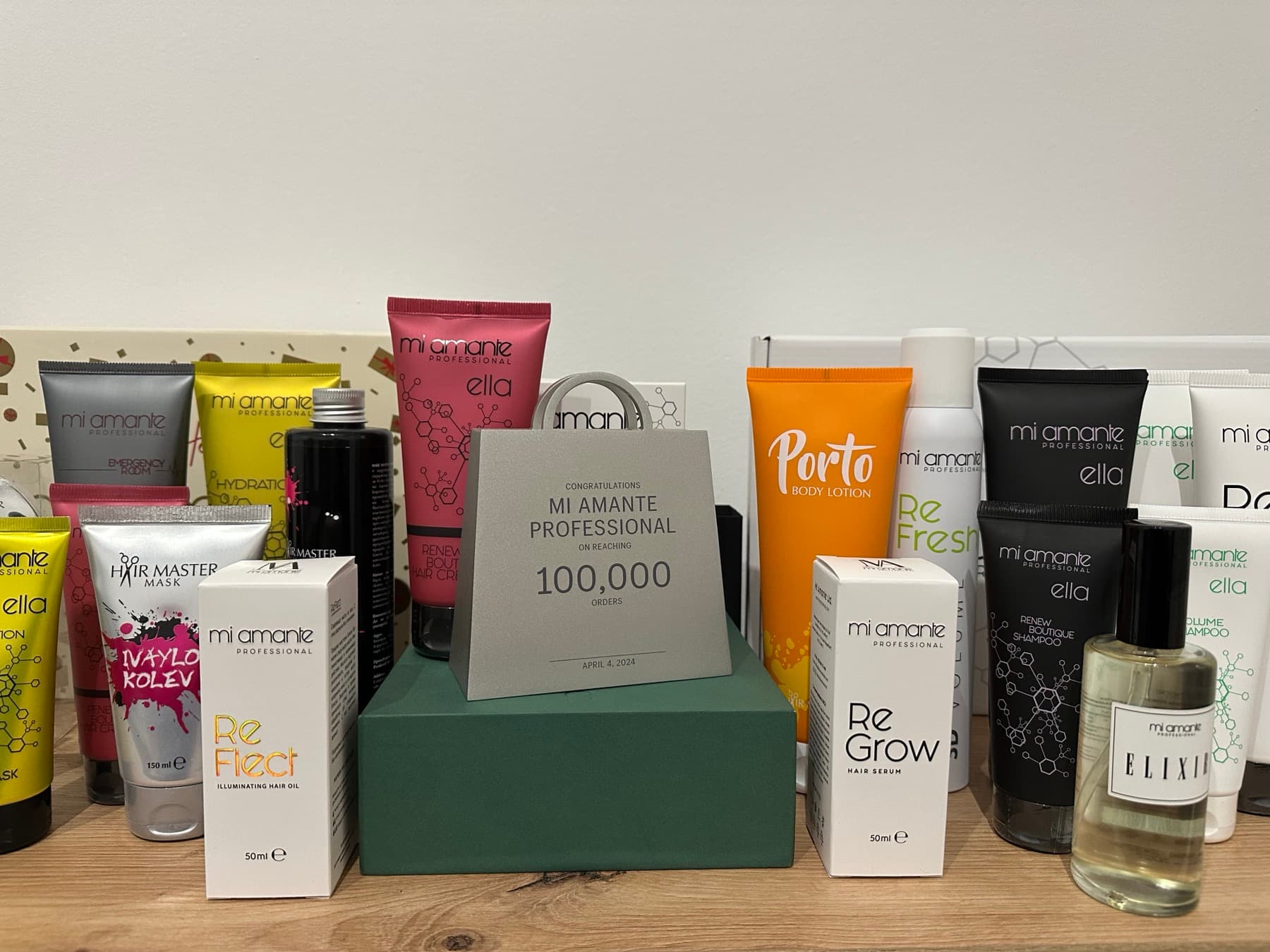 Mi Amante Professional product range photographed with the Shopify 100,000-orders milestone award